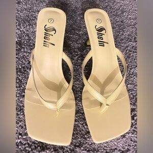 Women's slip on heel.  Color is soft yellow, new without tags.  Size 7